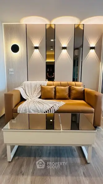 Modern living room with stylish leather sofa and elegant lighting