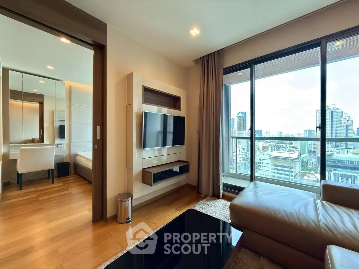 Luxurious living room with city view, modern furniture, and wooden flooring in high-rise apartment.