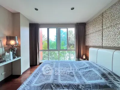 Luxurious bedroom with elegant decor and large window view