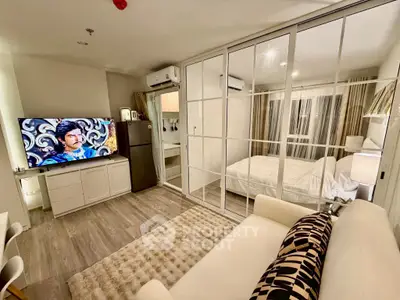Modern studio apartment with glass partition and stylish decor