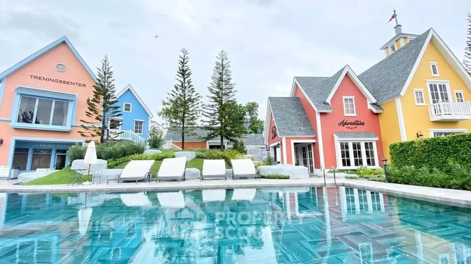 Charming colorful houses with a serene pool reflecting the vibrant architecture, perfect for a tranquil lifestyle.