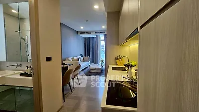 Modern apartment interior with open kitchen and cozy living area