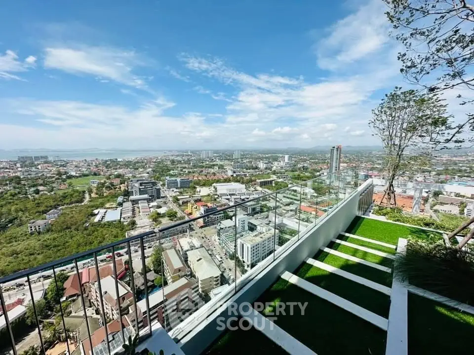 Stunning rooftop view of cityscape with lush greenery and modern design.