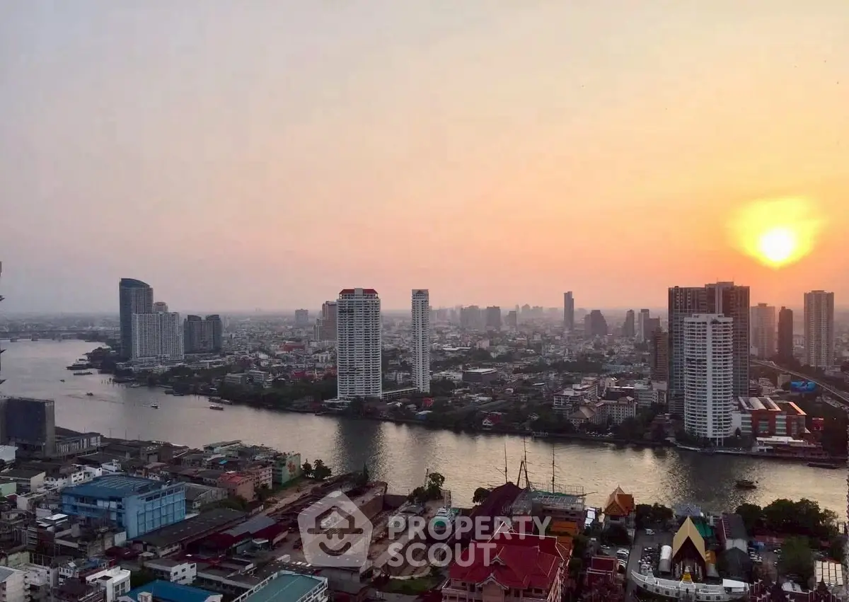 Stunning riverfront cityscape view at sunset with high-rise buildings and serene skyline.