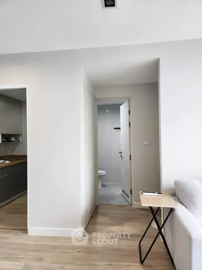 Modern apartment interior with sleek kitchen and cozy living area