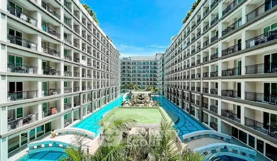 Luxurious apartment complex with stunning pool and modern architecture