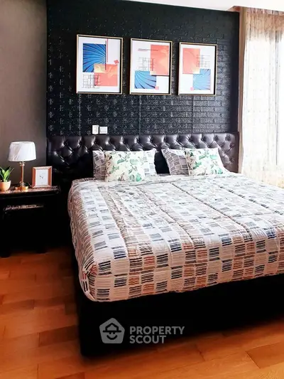 Stylish bedroom with modern decor and large bed in a cozy apartment