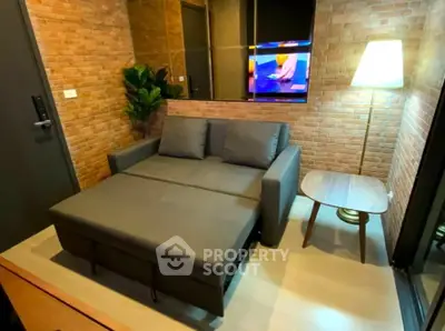 Cozy living room with modern sofa bed and stylish brick wall decor