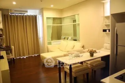 Modern open-plan living room with cozy sofa and dining area in elegant apartment.