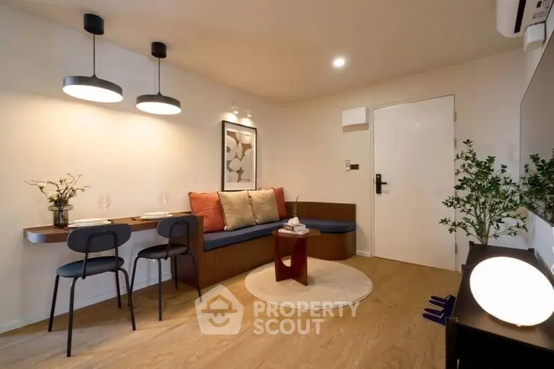 Modern living room with stylish decor and cozy seating area, perfect for relaxation and entertaining.