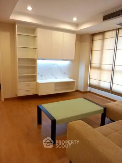 Modern living room with built-in shelves and stylish furniture