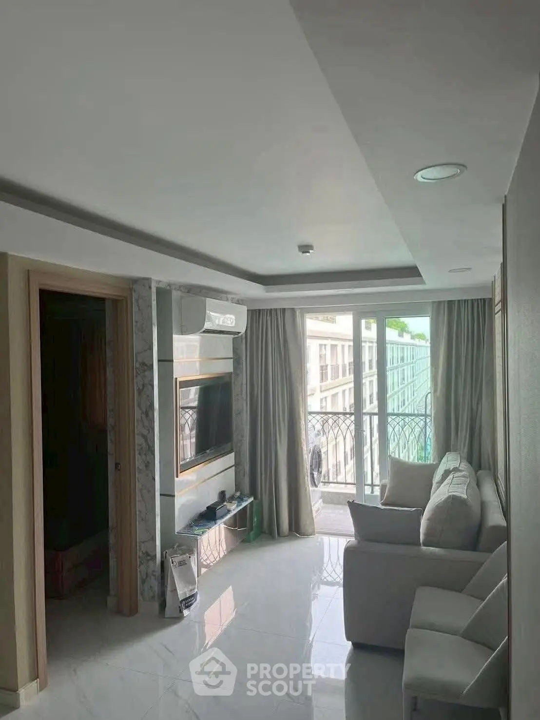 Modern living room with balcony view and sleek interior design