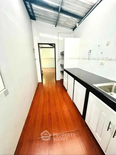 Modern kitchen with sleek countertops and ample storage space