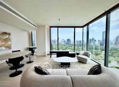 Luxurious modern living room with panoramic city views and elegant furnishings.