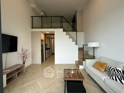 Modern loft apartment with stylish living room and mezzanine level