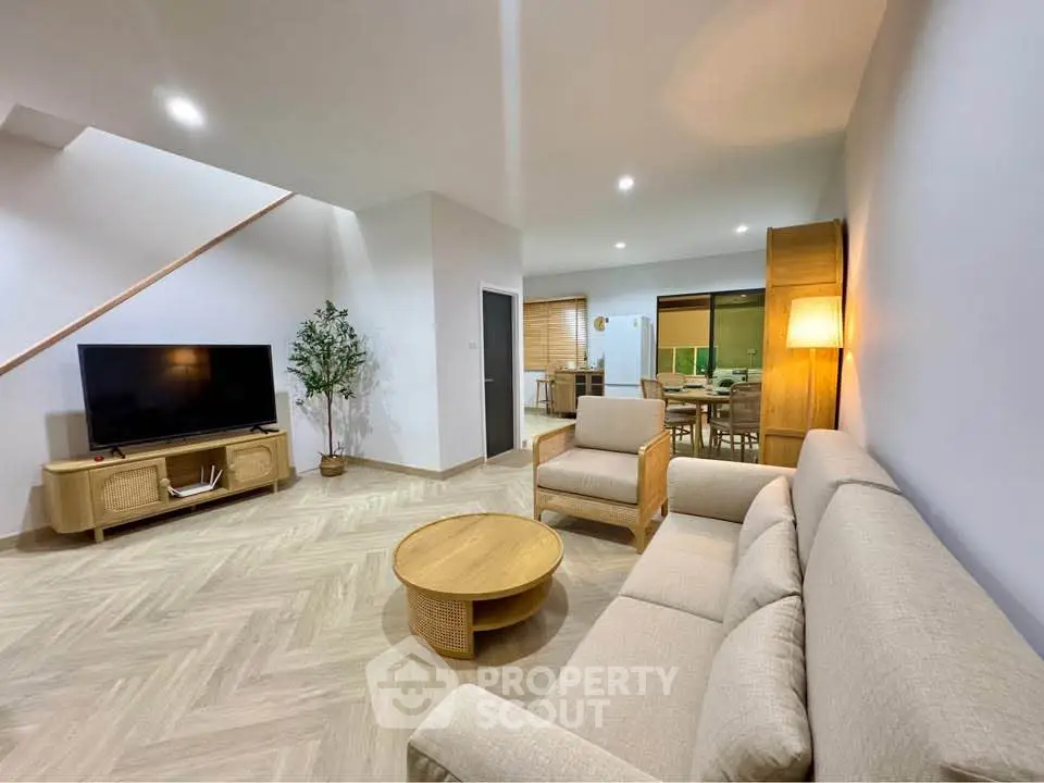 Spacious modern living room with cozy seating and stylish decor