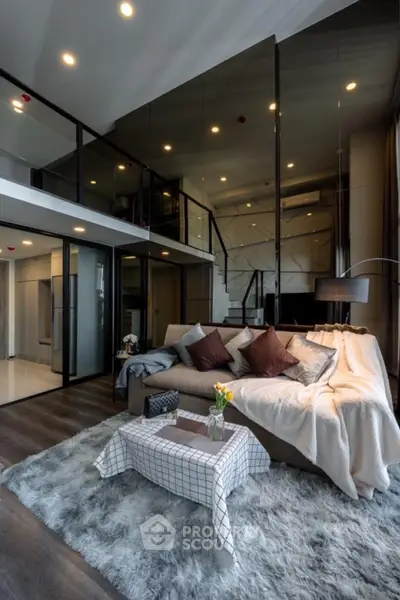 Luxurious modern living room with loft, plush sofa, and stylish decor