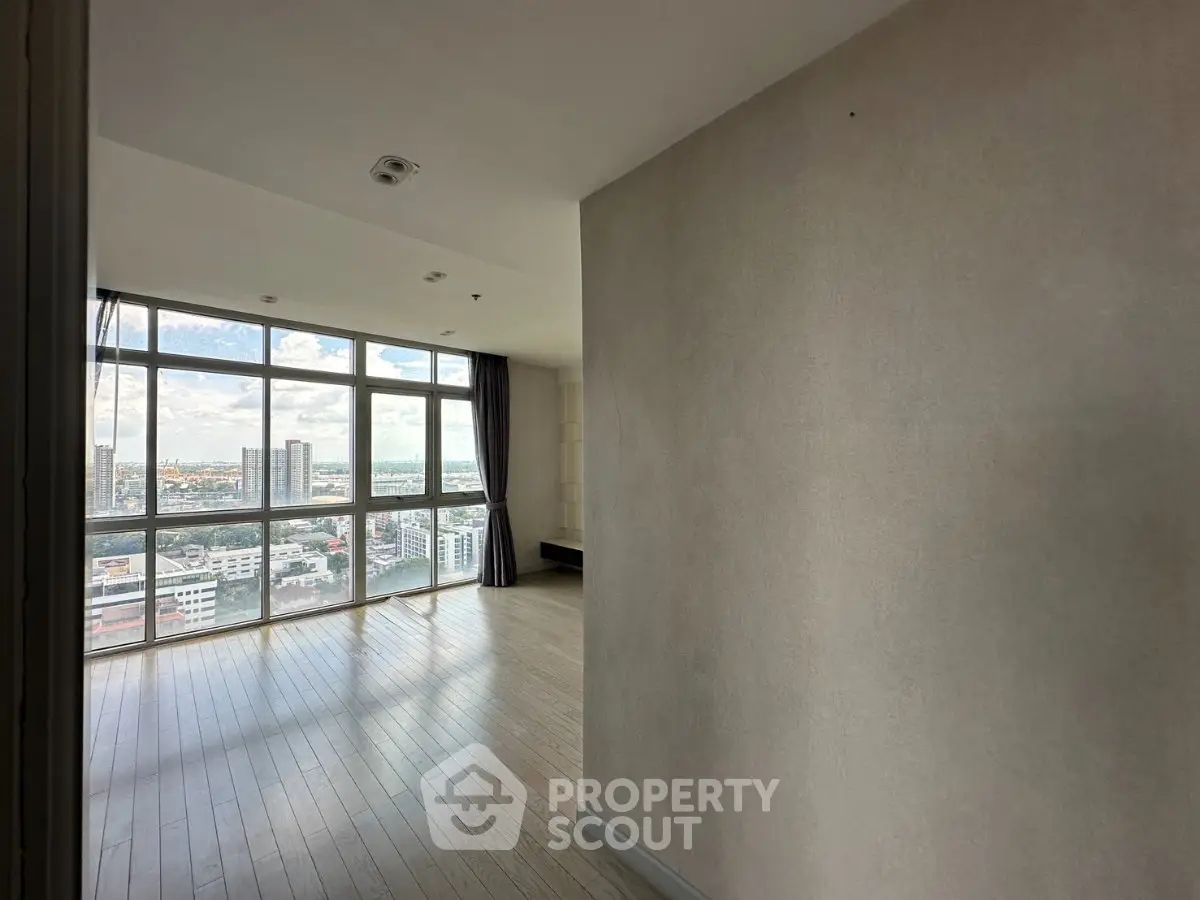 Spacious corner unit with floor-to-ceiling windows offering stunning city views.