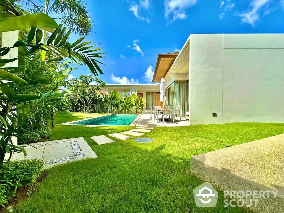 Luxurious modern villa with private pool and lush garden, perfect for serene living.