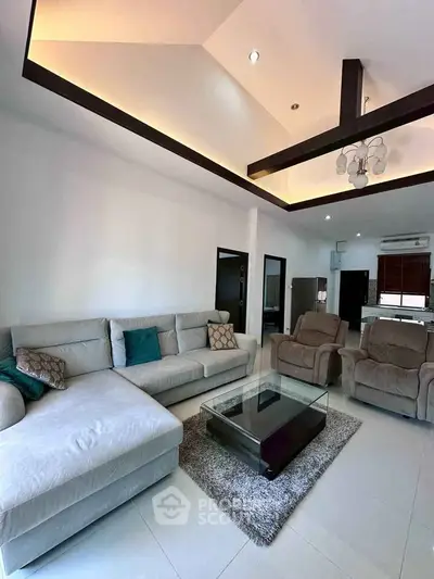 Spacious modern living room with high ceiling and elegant furniture