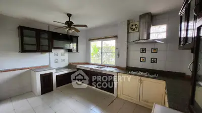 Spacious kitchen with modern appliances and ample natural light