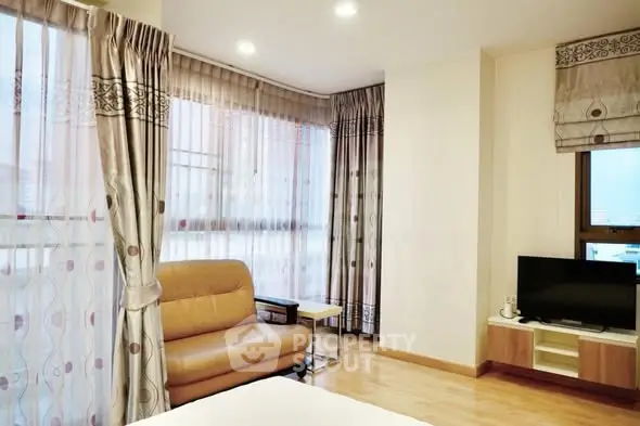 Bright and cozy living room with modern decor and ample natural light