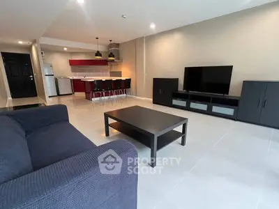 Spacious modern living room with open kitchen and stylish furniture