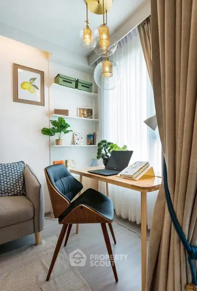Modern study area with stylish chair, wooden desk, and natural light from large window.