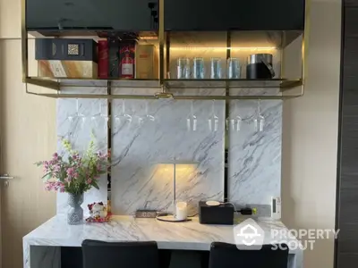 Luxurious home bar with marble countertop and elegant glass storage