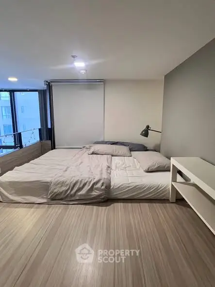 Spacious modern bedroom with large windows and minimalist decor