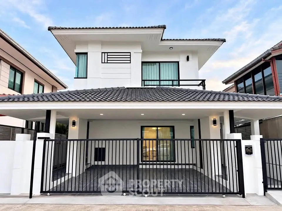 Modern two-story house with sleek design and spacious driveway