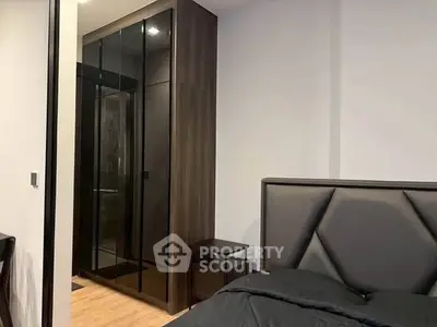 Modern bedroom with sleek wardrobe and stylish headboard