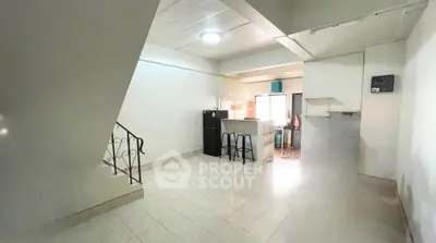 Spacious open-plan kitchen and living area with modern appliances