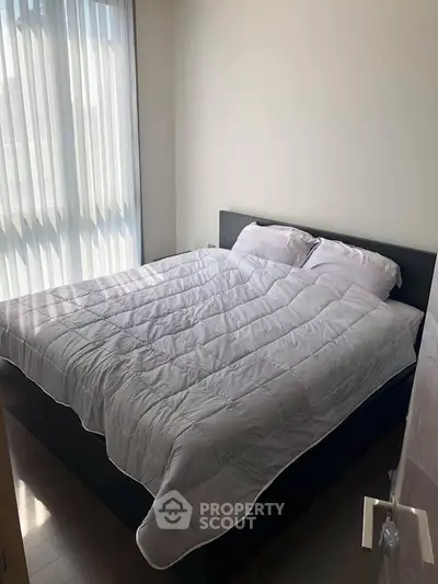 Cozy bedroom with natural light and modern decor
