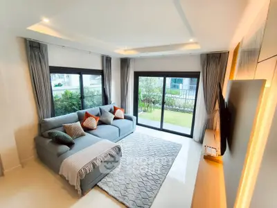 Spacious living room with modern decor and garden view