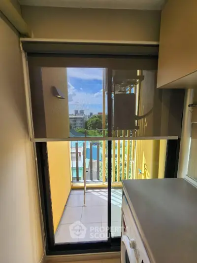 Modern apartment balcony with washing machine and scenic view