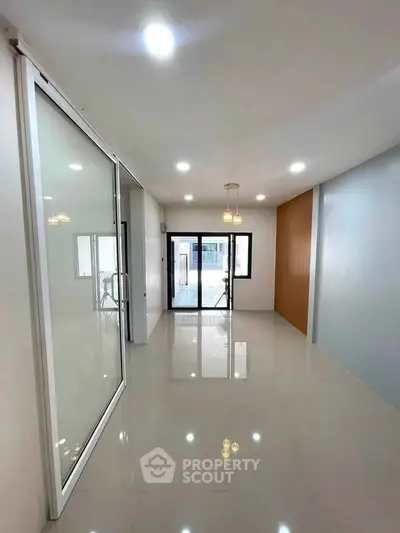 Spacious modern living room with sleek design and ample natural light