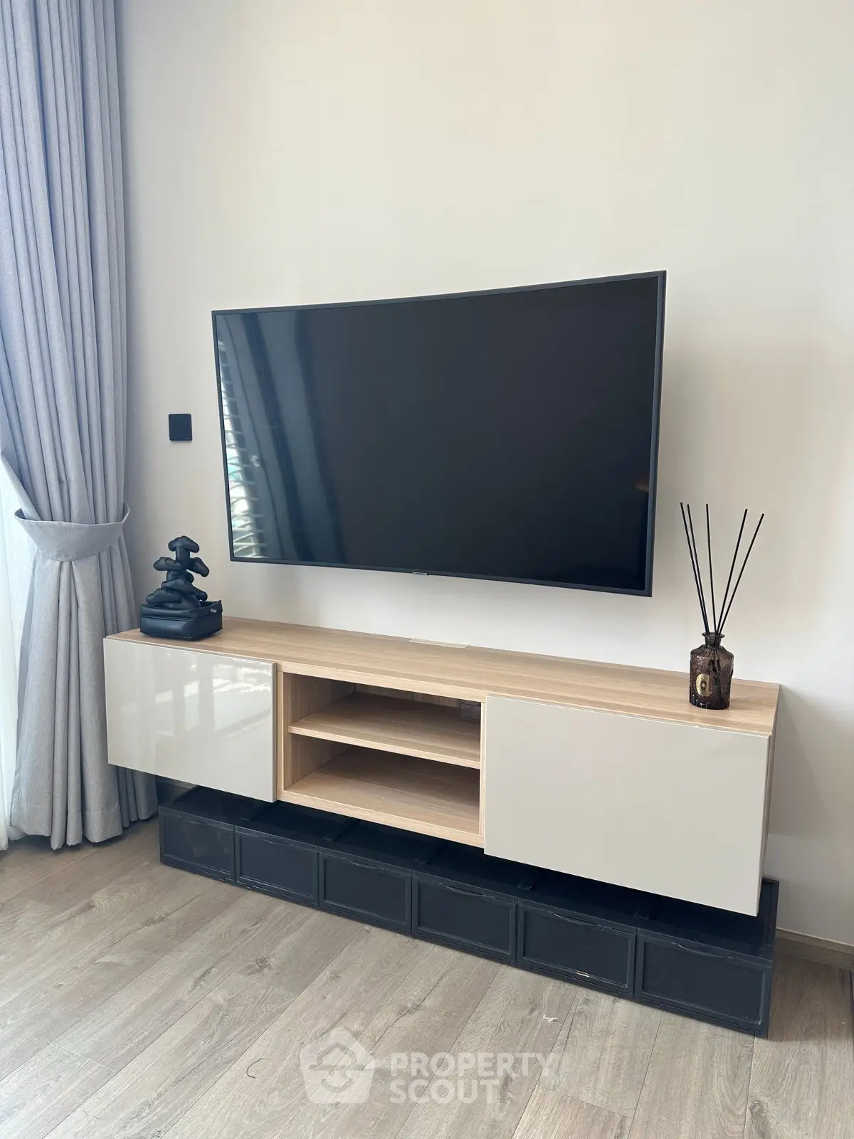 Modern living room with sleek TV unit and elegant decor