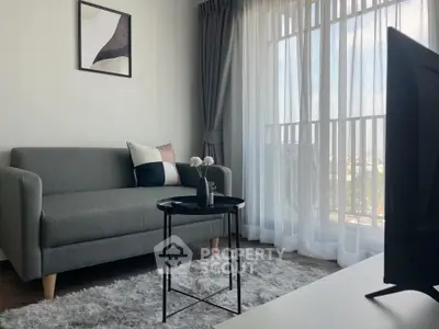 Modern living room with stylish sofa and large window view