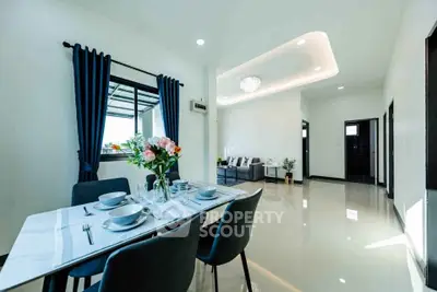Spacious modern living room with elegant dining area and stylish decor