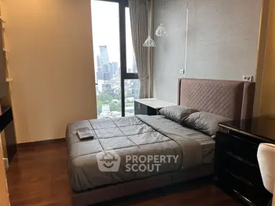 Modern bedroom with city view and stylish furnishings
