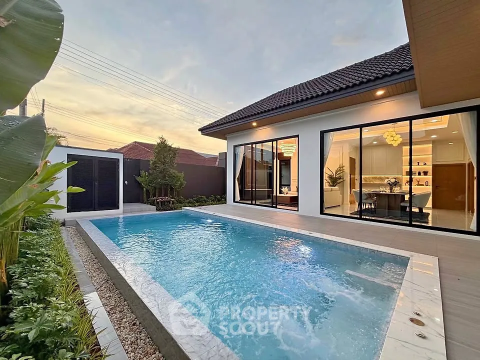 Luxurious modern home with private pool and elegant interior design, perfect for relaxation and entertaining.