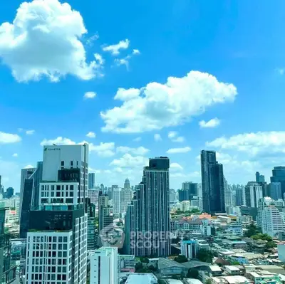 Stunning cityscape view of modern skyscrapers under a bright blue sky, showcasing urban living at its finest.