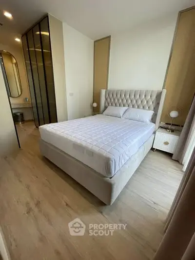 Modern bedroom with elegant design, featuring a plush bed and stylish decor, perfect for a cozy retreat.