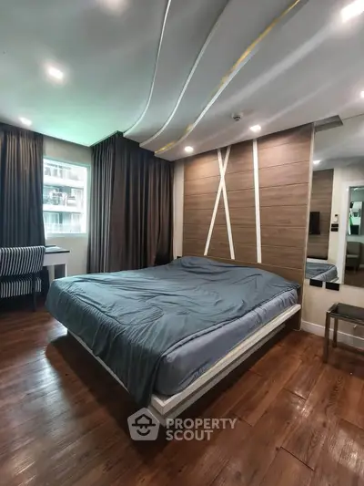 Modern bedroom with stylish wood paneling and cozy ambiance