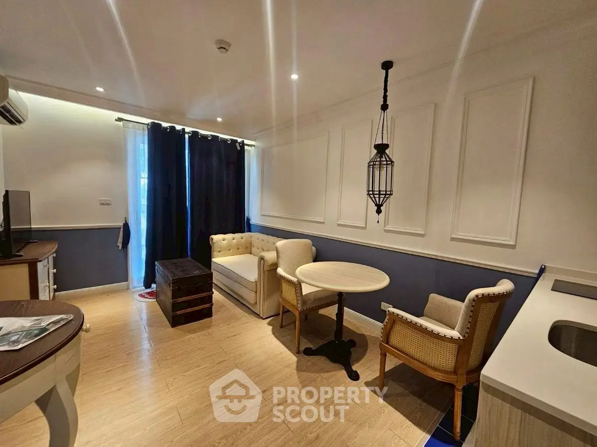 Charming living room with elegant decor and cozy seating area, perfect for relaxation.