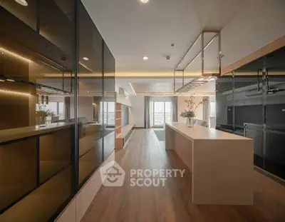 Modern open-plan kitchen with sleek design and ample natural light