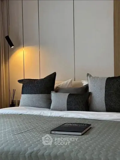 Luxurious modern bedroom with stylish decor and cozy ambiance.