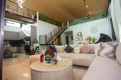 Luxurious open-plan living room with modern decor and spacious seating area.