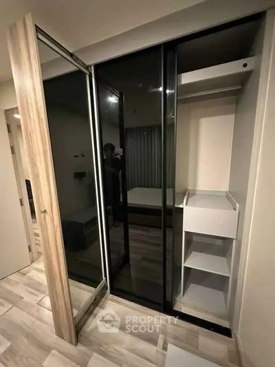 Modern bedroom with sleek built-in wardrobe and stylish flooring
